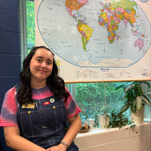 Sydney Bunk in front of world map